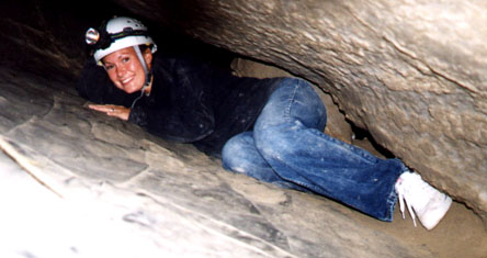 Natalie nears the bottom of the cave.