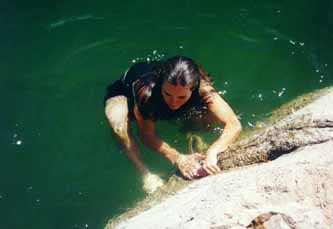 Sha climbs from the cold water