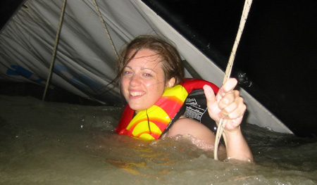 Amy swims through the ropes and cables below the mainsail