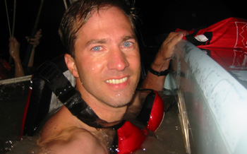 Shaun retrieves the radio and camera from the dry bag.